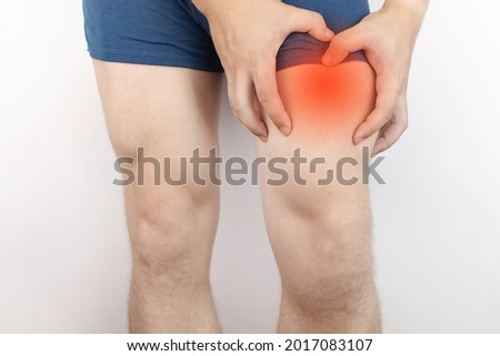The man is holding on to his thigh. Muscle rupture, tendon sprains, ligament microfractures and bone fractures. Hip pain medical treatment concept Royalty-Free Stock Photo #2017083107