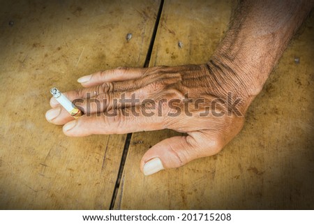 Man hand holding a cigarette