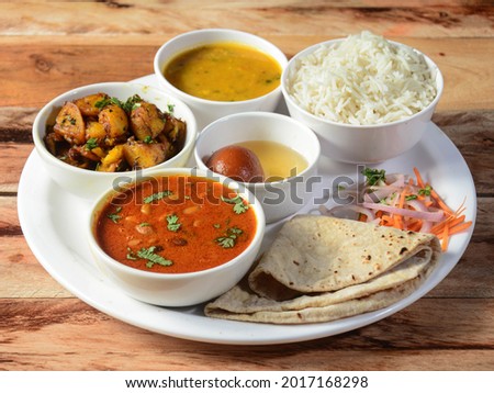 Indian Veg Rajma Thali, food platter consists variety of veggies, lentils, sweet dish, snacks etc., selective focus Royalty-Free Stock Photo #2017168298
