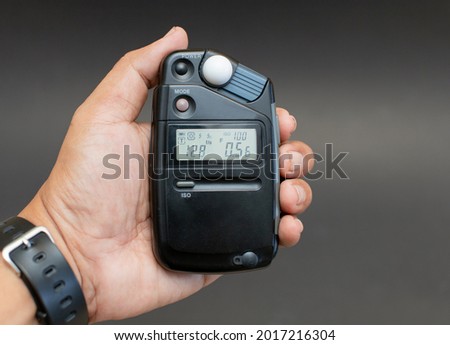 Light meter for photography in a black background.