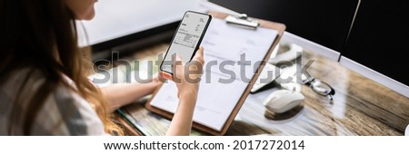 Invoice Document OCR. Taking Photo With Mobile Phone Royalty-Free Stock Photo #2017272014