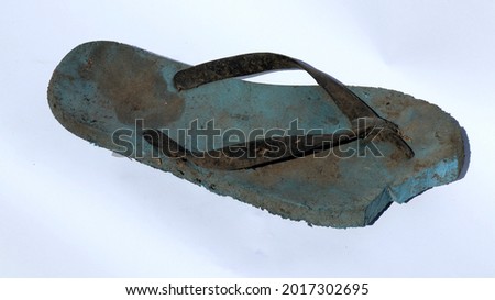 Flip-flops are broken and dirty
					 Royalty-Free Stock Photo #2017302695