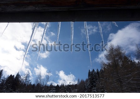 hanging icicle from frozen water on a cold winter day Royalty-Free Stock Photo #2017513577