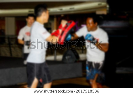 Abstract blur mixed martial artists doing demonstration and education