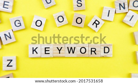 Selective focus of a word keword on a yellow background