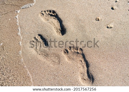 footprint of a human on the sandy beach, travel vacation concept