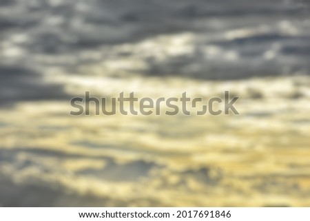 Defocused abstract background of view of clouds and sunset at dusk
