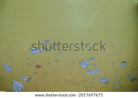 Old dirty painted wall. Several layers of peeling paint. rusty blur. background texture. Horizontal orientation