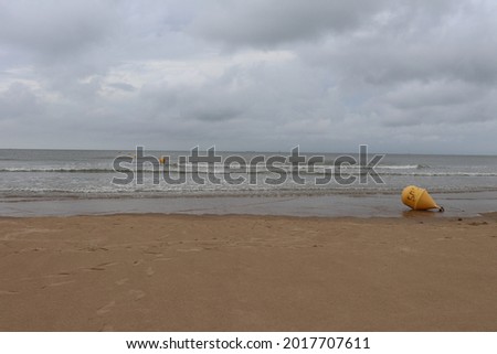 The sandy beach of Calais along the Channel sea, city of Calais, departement of Pas de Calais, France Royalty-Free Stock Photo #2017707611