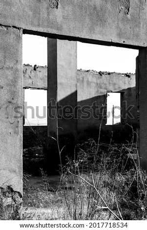 Remains of abandoned buildings of the mines of La Union village in Cartagena province, Murcia community, Spain. Monochrome picture.