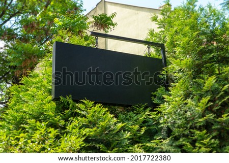 Blank company sign surrounded by trees for logo branding mockup 