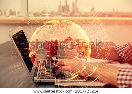 Double exposure of man hands holding a credit card and social network theme drawing. Digital finance and E-commerce concept.