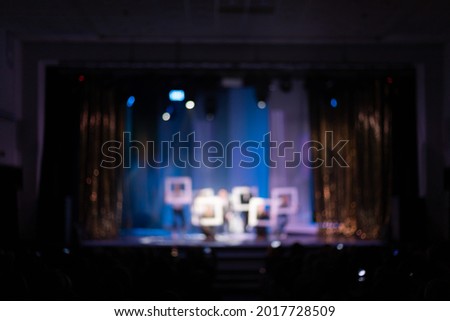 Blur texture background for design. Сoncert on scene theater, stage light with colored spotlights and smoke.
