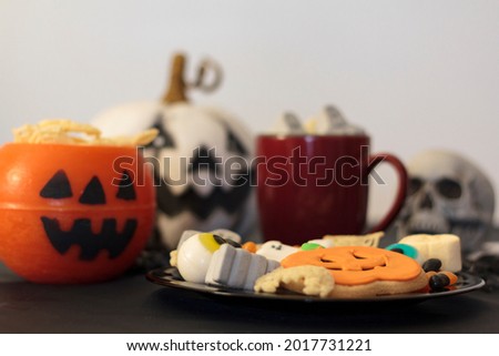 Halloween table with assorted fun and spooky treats and decoration