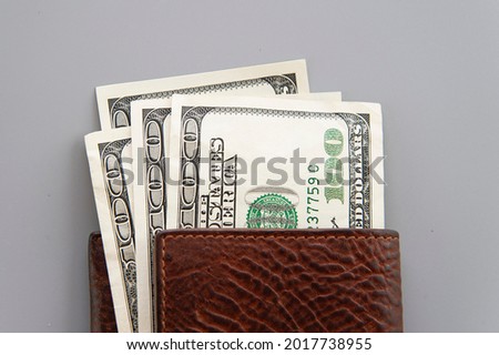 dolars in wallet on gray background Royalty-Free Stock Photo #2017738955