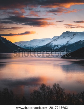 Sunset in Hardanger fjord in Norway Royalty-Free Stock Photo #2017745963