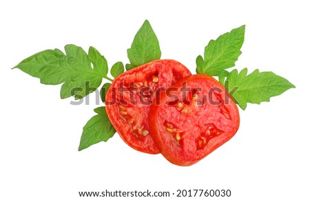 Tomato cut, in circles, on leaves, top view, isolated on a white background