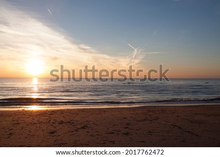 Beautiful and empty beach sea at sunrise or sunset time
