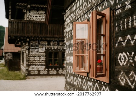 Cicmany, Slovakia - june 08, 2021: Old wooden houses in Slovakia village Cicmany, traditional painted with white paint. Cicmany, Slovakia