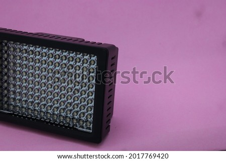 photo of led light for video shooting isolated in pink