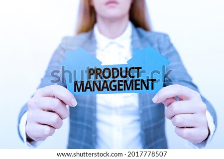 Text caption presenting Product Management. Conceptual photo organisational lifecycle function within a company A Young Lady Businesswoman Holding Presenting Home In Business Outfit