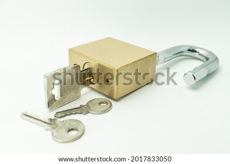 Unlocked Padlock and key on the white background