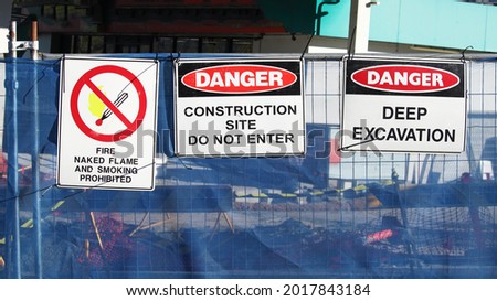 Multiple warning signs on a construction site