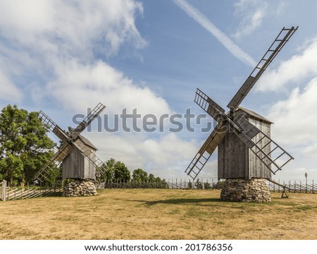 Photo of two windmills at windmill farm on the sunny day