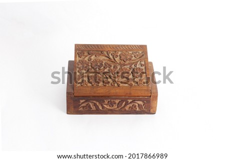 Wooden Half Open carved box handmade. Patterns of Indian culture in the form of New Age Source The Carved Wood Box Flower of Life. Isolated on a white background.