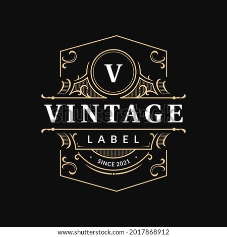 Ornate vintage badge label with flourish swirl ornament elegant luxury typographic logo for your business, shop sign, label, whiskey, rum, beer, scotch, vodka, cognac, bakery etc