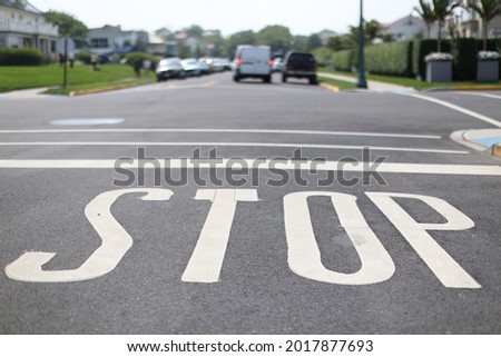 Pavement marking warning to stop at urban intersection