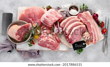 Assortment of raw pork meat on light grey background. Organic gourmet food concept. Top view, flat lay Royalty-Free Stock Photo #2017886531