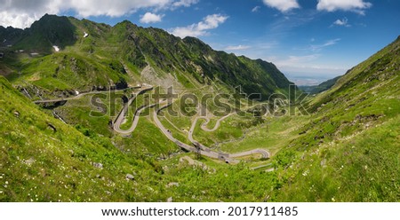 Big panorama of Transfagarasan road in summer. Located in Carpathian Mountains in Romania, Transfagarasan road is one of the most impressive mountain roads in the world. Royalty-Free Stock Photo #2017911485