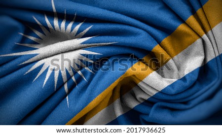 The national flag of Marshall Islands. Marshall Islands flag with fabric texture. Close up waving flag of Marshall Islands.