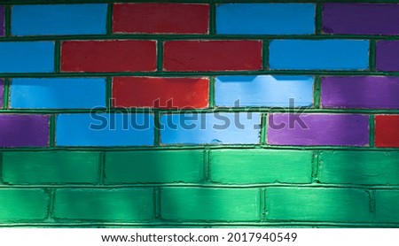 Colored colorful brick wall as texture background. Detail for design. Design elements. Macro. Background for business cards, postcards and posters. 