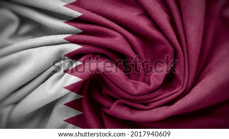 The national flag of Qatar. Qatar flag with fabric texture. Close up waving flag of Qatar.