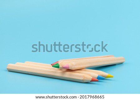 Colour pencils on blue background. Back to school. Education concept