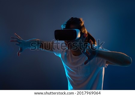 Young man using virtual reality headset. VR gadgets