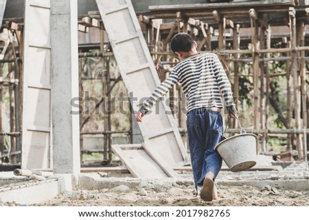 The concept of child labor, Poor children are forced to work in construction, Violence children and trafficking concept,  Rights Day,  World Day Against Child Labour concept Royalty-Free Stock Photo #2017982765