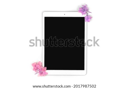Digital tablet pc creative art mockup and template with floral dried flowers isolated on a white background, copy space 