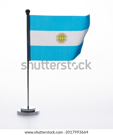 Argentinian table flag waving on white background.