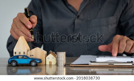 A young man who destroys his home finance account with his car, house bills in several months installments, bank debt concept.