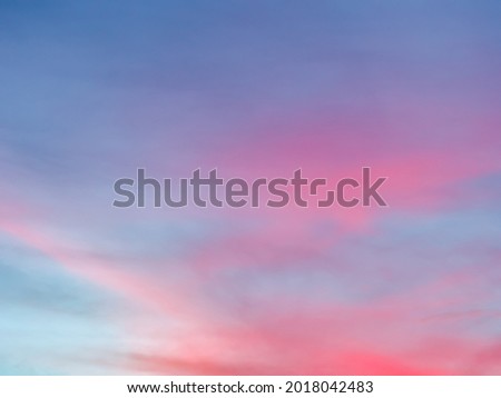 Dramatic cloudscape at sunset. Fancy clouds in the sky. Twilight heaven with blue and pink clouds.
