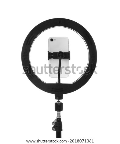 Tripod with ring light and smartphone isolated on white Royalty-Free Stock Photo #2018071361