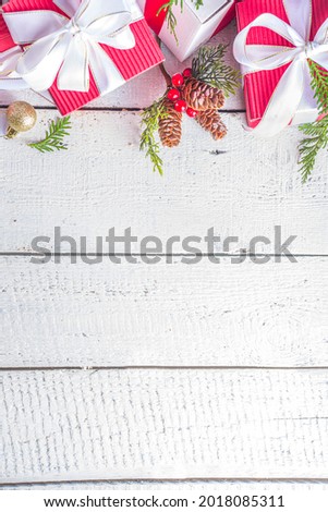 Merry Christmas and Happy New Year. Noel greeting card background.  Christmas gift boxes with festive ribbons, flatlay top view copy space, banner