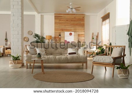 Spacious room interior with stylish wooden furniture. Idea for design