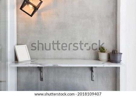 Decorative wooden shelf on white wallpaper background.