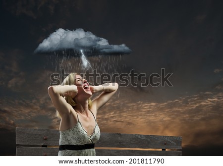 Young woman sitting on bench closing ears with palms and screaming