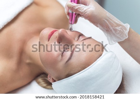 Woman having facial treatment in beauty salon, closeup. Oxy derma therapy Royalty-Free Stock Photo #2018158421