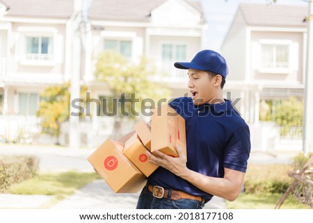 Delivery man holding cardboard boxes to customer home.  Fast and free Delivery transport . Online shopping and Express delivery .
